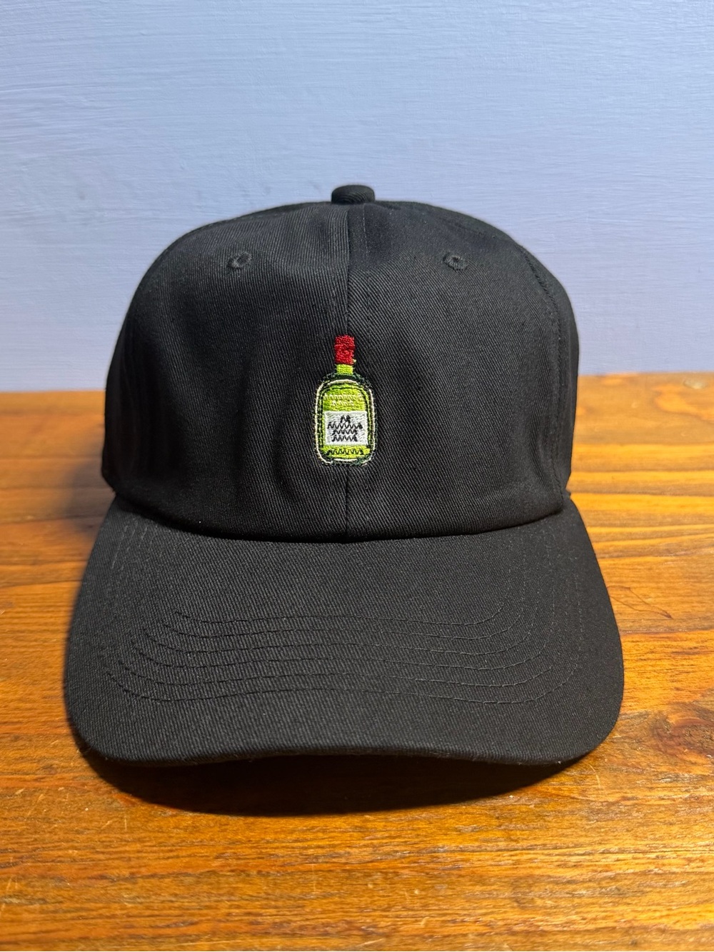 Black unstructure Dad Hat with Embroidered Buchanan Bottle logo design